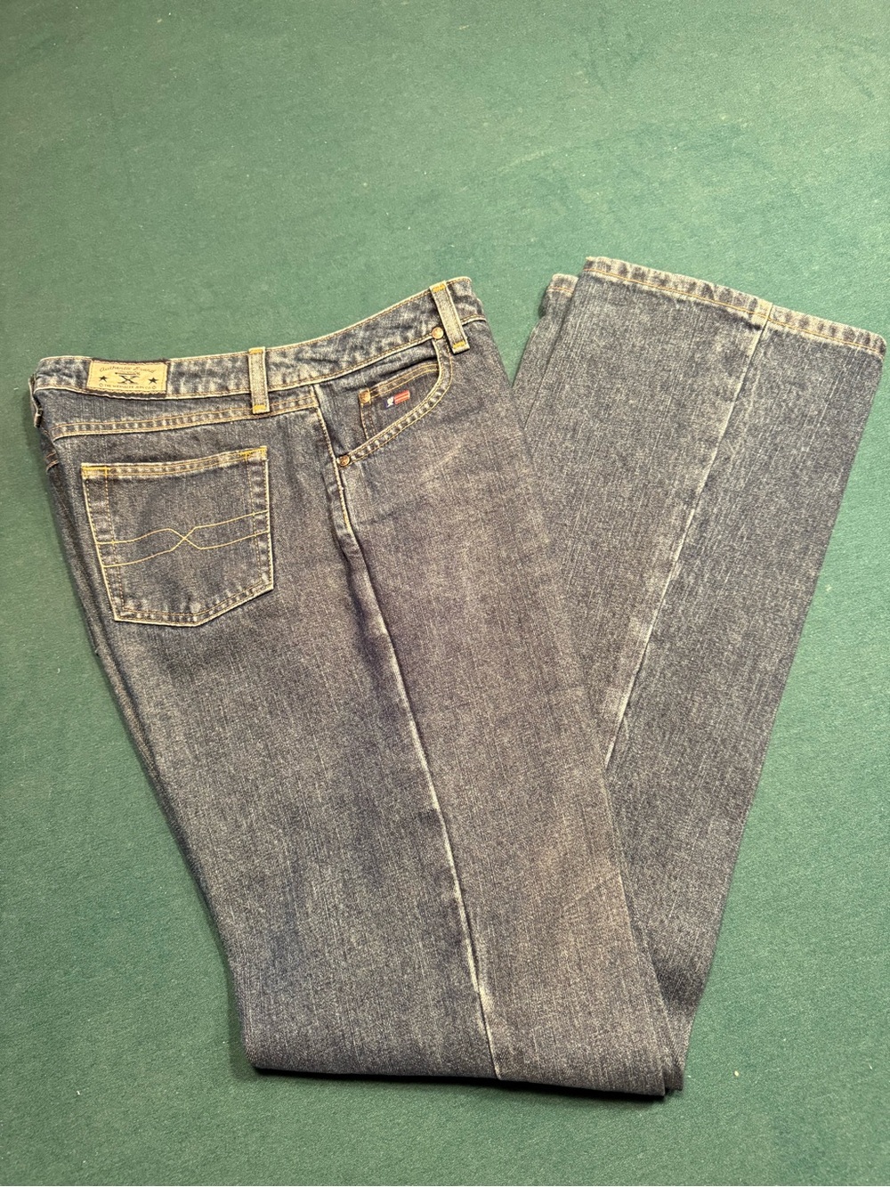 Women’s Boot Cut Jeans in Faded Indigo - [Brand]